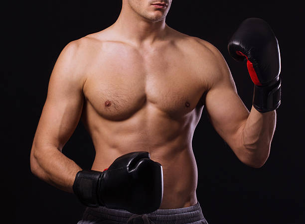 istock Handsome unrecognizable shirtless boxer, isolated on black 158767817