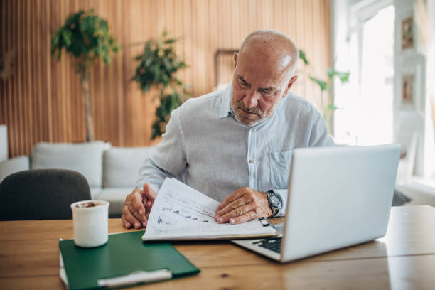 istock Mature man working at home 1587679945