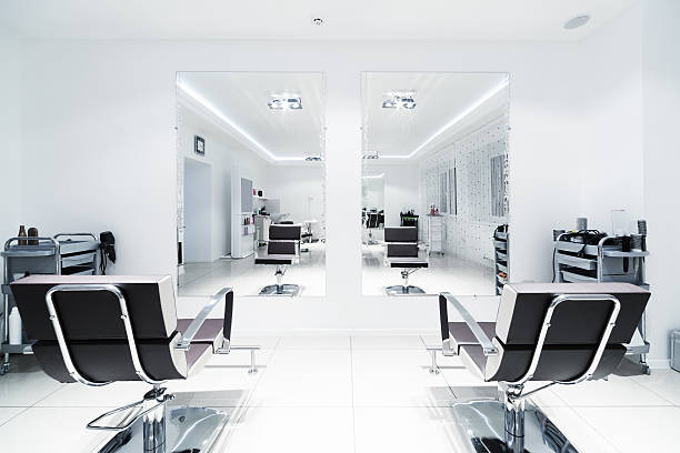 chairs and mirrors chairs and mirrors in modern hairdressing salon mirror stock pictures, royalty-free photos & images