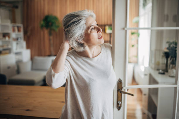 istock Mature woman at home 1587695591