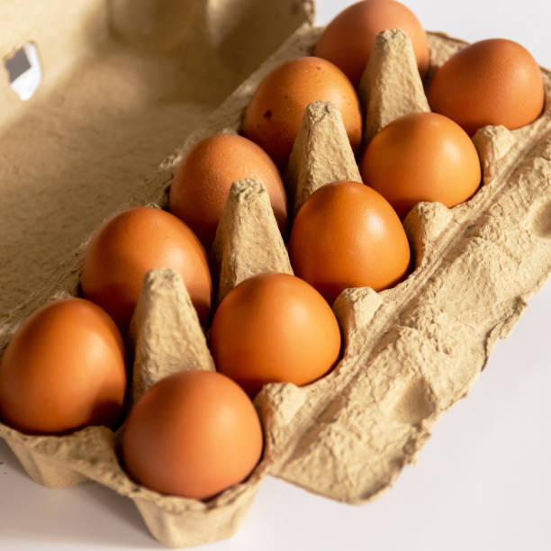 istock Brown chicken eggs in open egg carton. 1587698857