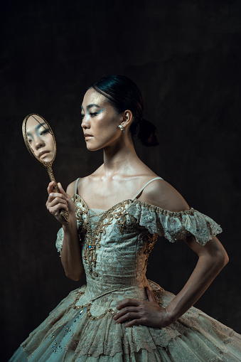 Portrait of asian balerina in dark room