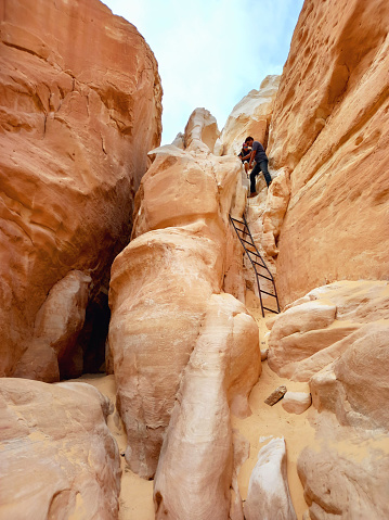 May 2023, Colored Canyon in the Sinai Peninsula Desert: Climbing in the natural rock formations of the Canyon in the desert. Extreme activities and sports in the desert.