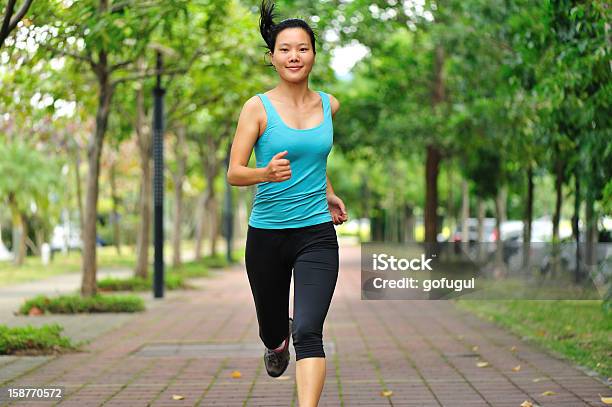 Woman Runner Stock Photo - Download Image Now - Asian and Indian Ethnicities, Mature Adult, One Woman Only