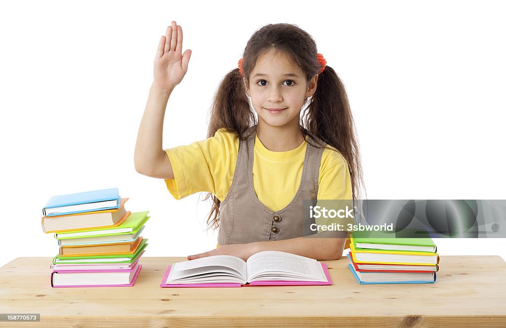 Girl with books and raises his hand up Girl with books and raises his hand up, isolated on white Alertness Stock Photo