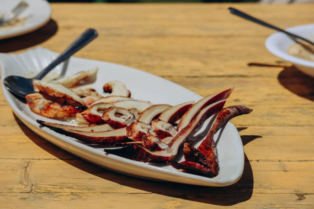 istock Fried squid on an outstretched plate on a yellow table 1587707799