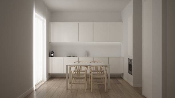 istock Minimalist white small kitchen design in one bedroom apartment with parquet floor and window with dining table, clean interior design, modern contemporary architecture concept idea 1587710568