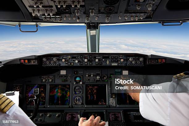 Pilots Working In An Aeroplane During A Commercial Flight Stock Photo - Download Image Now