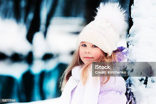 Portrait Of Cute Little Girl At Beauty Winter Forest Background Stock Photo - Download Image Now