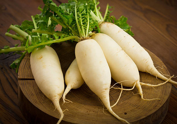 White radish White radish on the wooden table dikon radish stock pictures, royalty-free photos & images