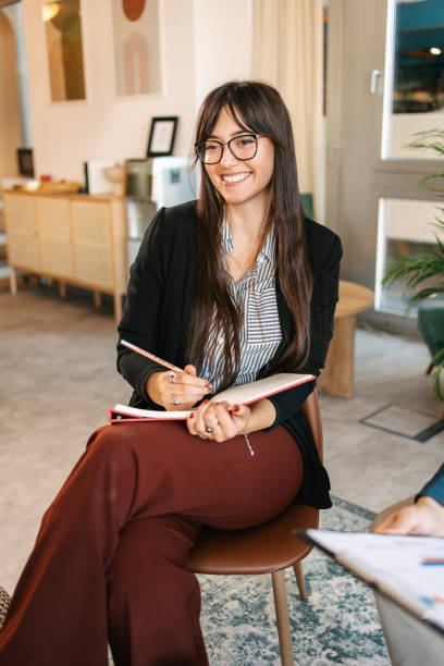 istock Woman from human resources on a meeting smiling 1587743491
