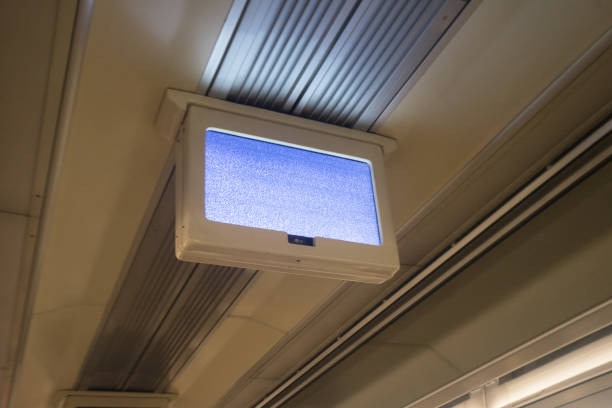 istock LCD monitor with static screen on top of train ceiling 1587752049