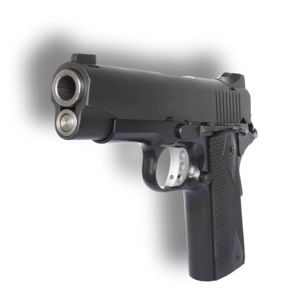 Black semi auto pistol and shadow behind