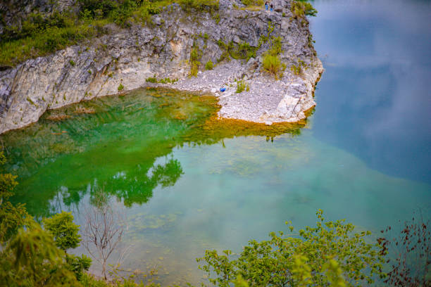 istock Beautiful rocky mountains and green ponds 1587774769