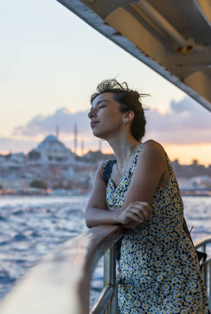 istock Portrait of young lady at sunset. 1587793211