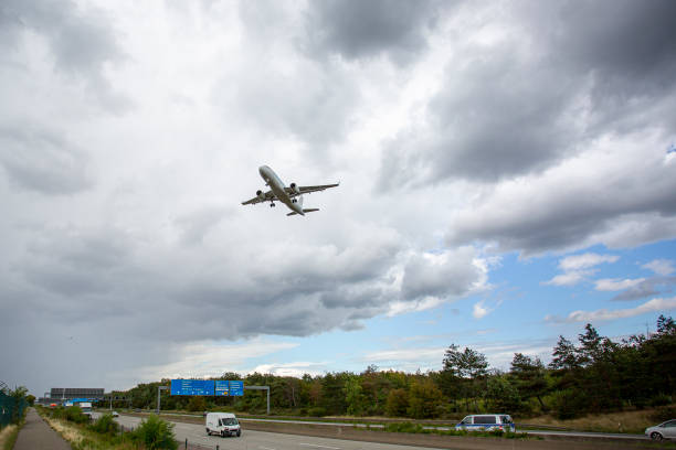 istock Landing airplane - German highway A5, Frankfurter Kreuz 1587804071