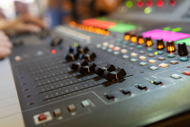 istock Close up of a professional musical sound mixing console. Selective focus on buttons. Blurry background. Concerts and live music 1587804086