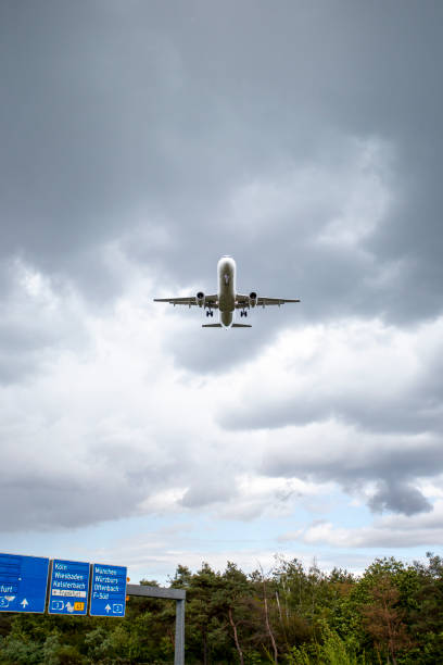 istock Landing airplane - German highway A5, Frankfurter Kreuz 1587804637