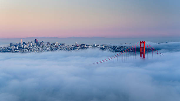 Golden gate bridge above clouds in San Francisco