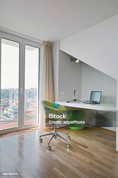 Modern Armchair And Desk In Garret Stock Photo - Download Image Now - Computer Stand, French Doors, Living Room