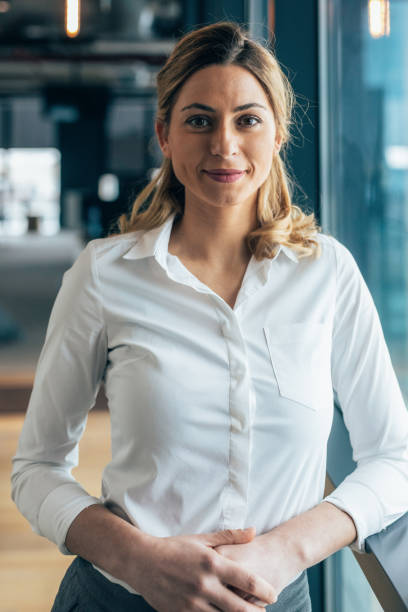 istock Confident businesswoman in modern office 1587810038