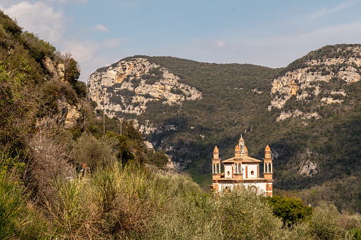 Finale Ligure, Savona, Liguria, Italy - 04 10 2023: The church stands on a hill in a dominant position over the valley and very panoramic.