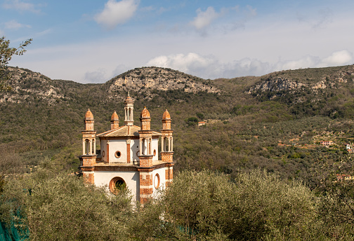 Finale Ligure, Savona, Liguria, Italy - 04 10 2023: The church stands on a hill in a dominant position over the valley and very panoramic.