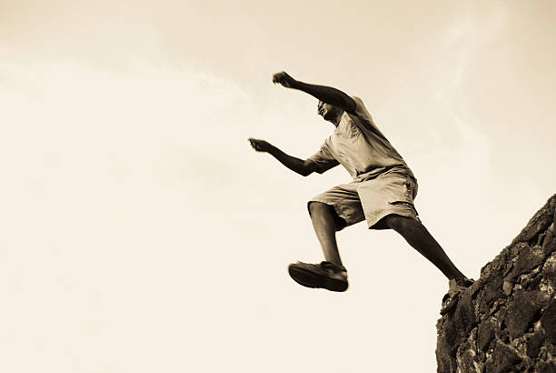 istock escape; man running against sky 158784744