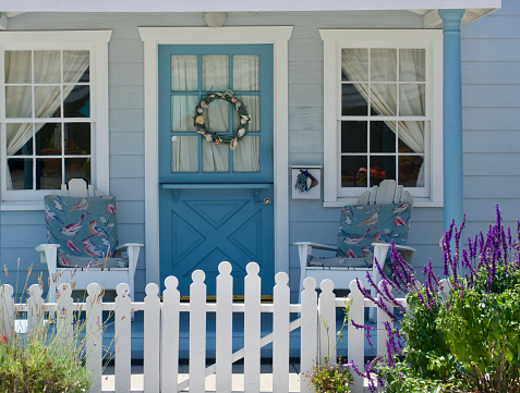 Cute beach bungalow with Aqua door and picket fence