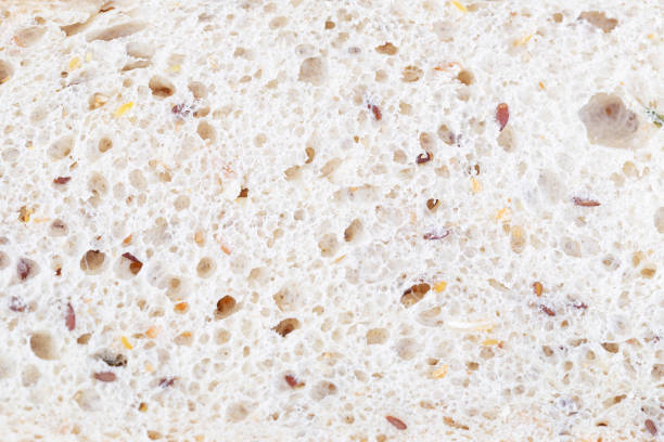Detail of a slice of bread. You can see the bread crumb with its alveoli. Healthy bread.