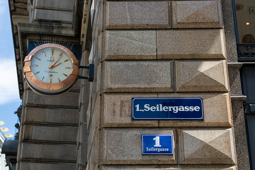 Riga, Latvia: Riga Central Station (Rīgas Centrālā stacijа) - Riga sign on the clock tower at 2.09 pm - iconic railway station city sign.