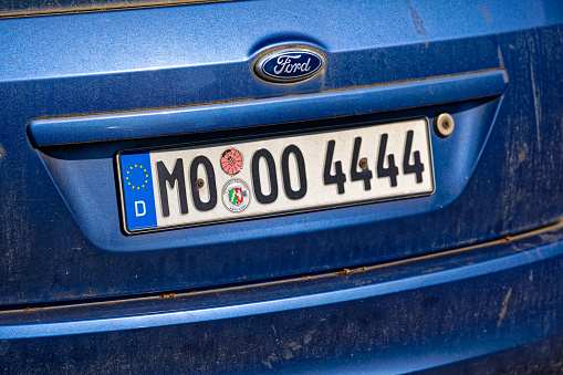 Rear view of German car license plate of parked Ford car at City of Zürich district Schwamendingen on a sunny spring day. Photo taken June 1st, 2023, Zurich, Switzerland.