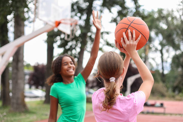 istock Girls playing basketball 1587892829