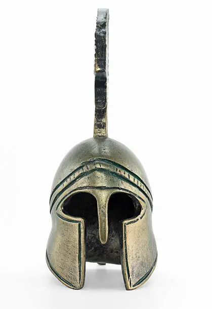 Ancient greek helmet replica on white background