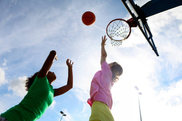 istock Friends playing basketball 1587895901