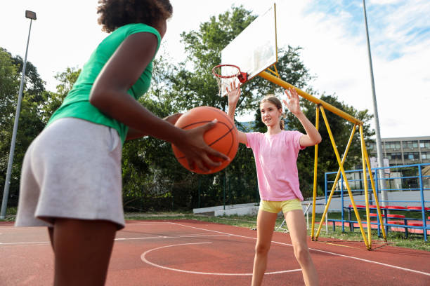 istock Friends playing basketball 1587897691