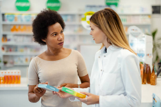 istock Pharmacist Helping Black Female Customer 1587899902