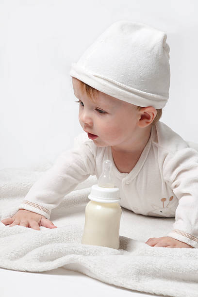 The Baby in white cap stock photo