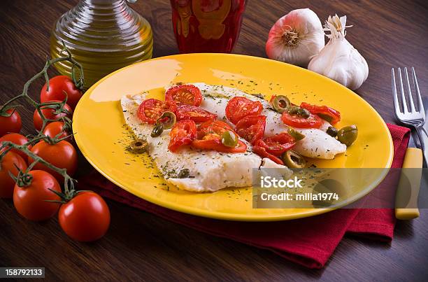 Fish With Cherry Tomatoes And Olive Stock Photo - Download Image Now - Cod, Olive Oil, Fillet
