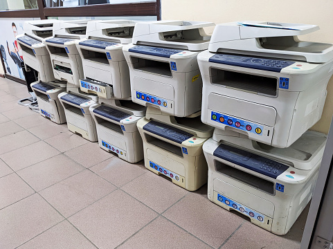 Heap of old printers, xerox equipment ready for e-waste recycling