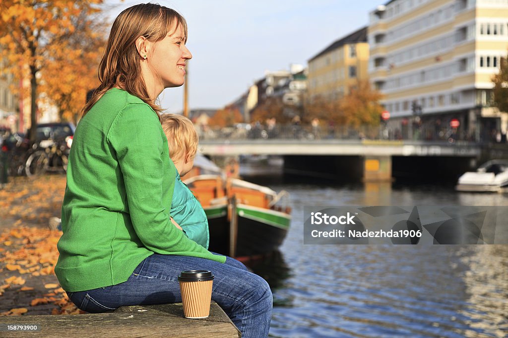 family in Copenhagen, Denmark mother and son looking at ships in Copenhagen, Denmark Copenhagen Stock Photo