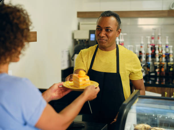 istock Customer and Employee in a Cafe 1587958108