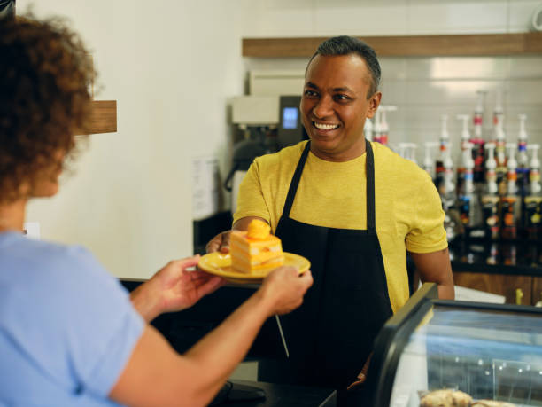 istock Customer and Employee in a Cafe 1587958634