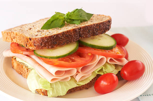 istock Tasty ham, tomato and cucumber sandwich 158797045