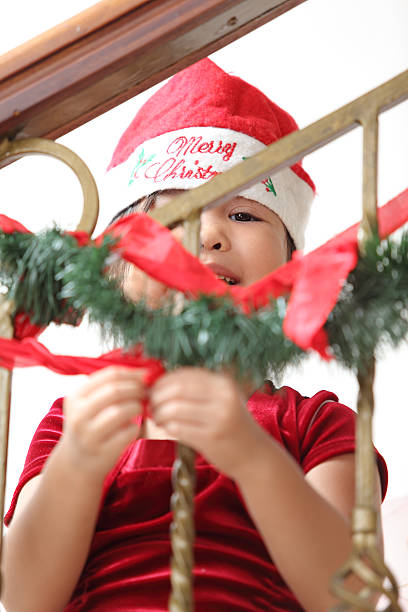istock Little Girl Decorating For Christmas 158797159