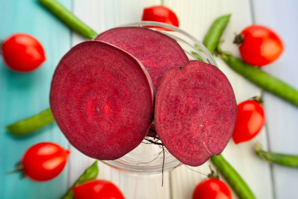 sliced beetroot on wood sliced beetroot on wood background healthy eating red above studio shot stock pictures, royalty-free photos & images