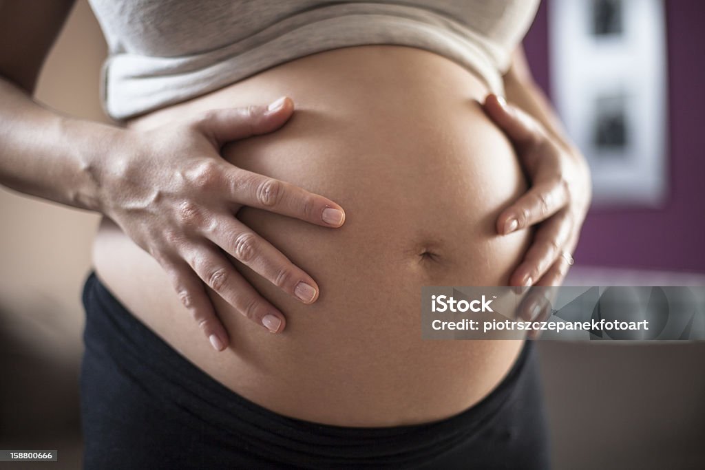 Pregnant belly pregnant woman holding her hands on her belly Abdomen Stock Photo