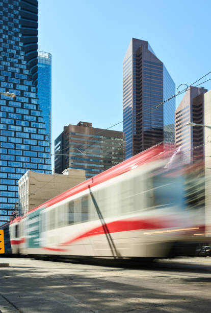 istock Commuter train moving along tracks in the city 1588016307
