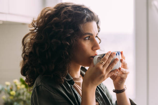 istock A Serious Beautiful Woman Looking Away While Drinking Tea 1588090792
