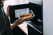 A Close Up View Of An Unrecognizable Woman Preparing To Eat Her Snack